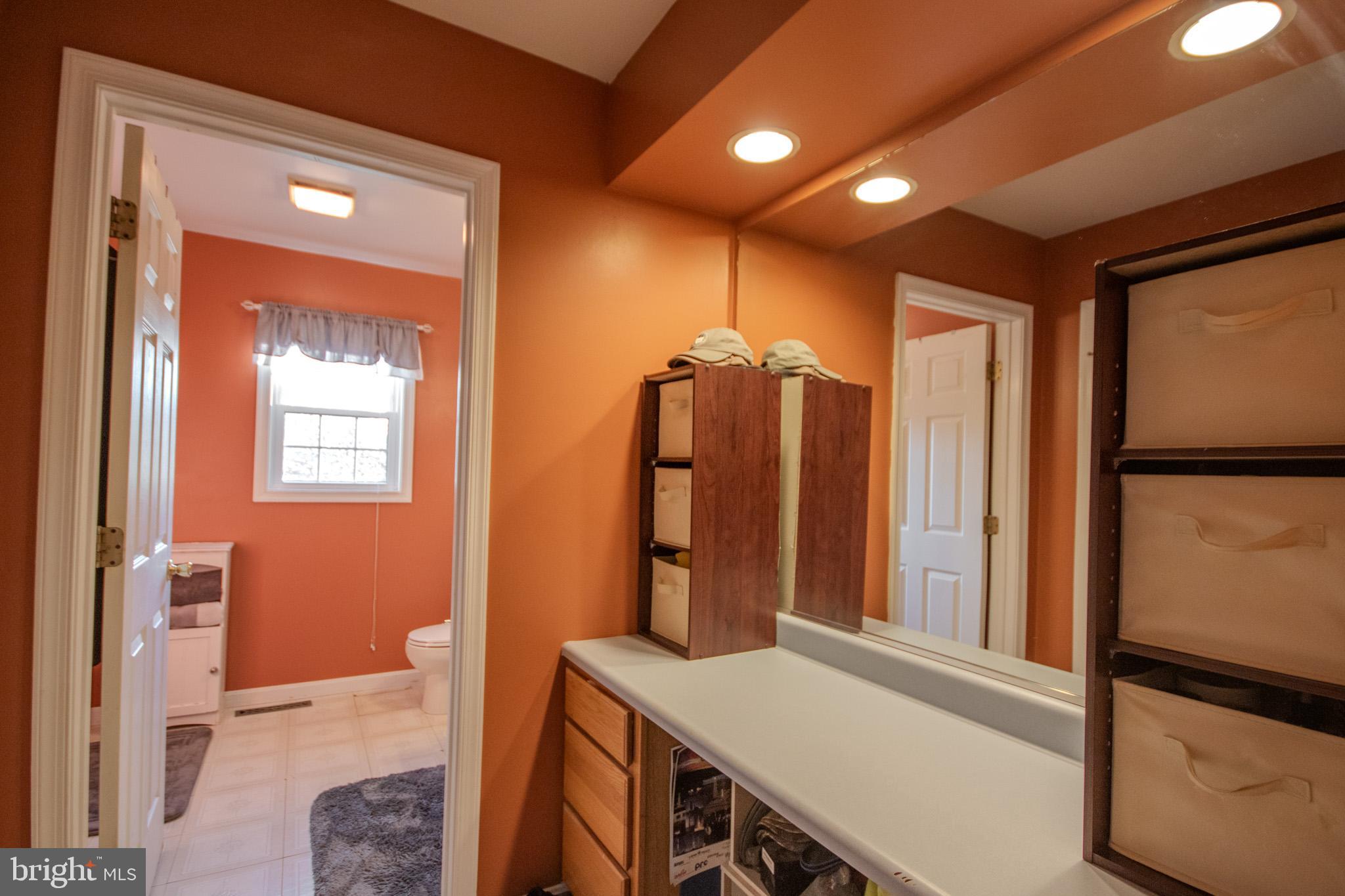 5520 Cedarcrest Road Salisbury, MD 21801 - Photo 21 of 41 a bathroom with a sink a mirror and a shower