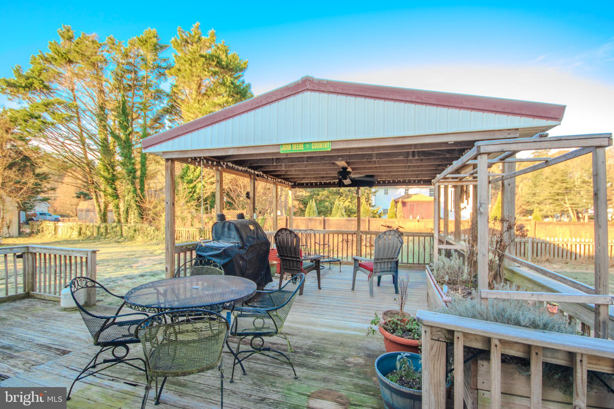 5520 Cedarcrest Road Salisbury, MD 21801 - Photo 31 of 41 a patio with table and chairs and potted plants