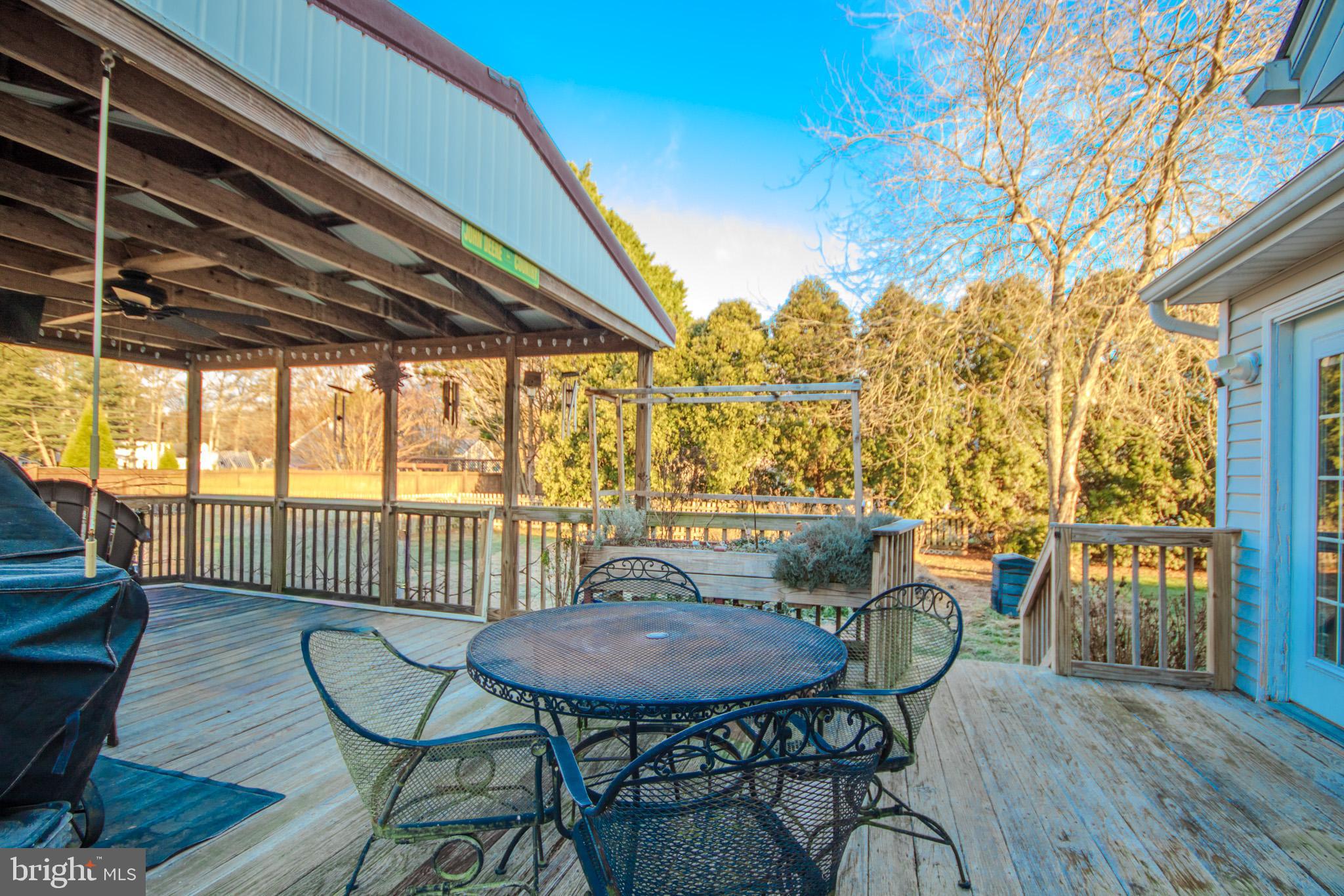 5520 Cedarcrest Road Salisbury, MD 21801 - Photo 32 of 41 a view of a balcony with table and chairs