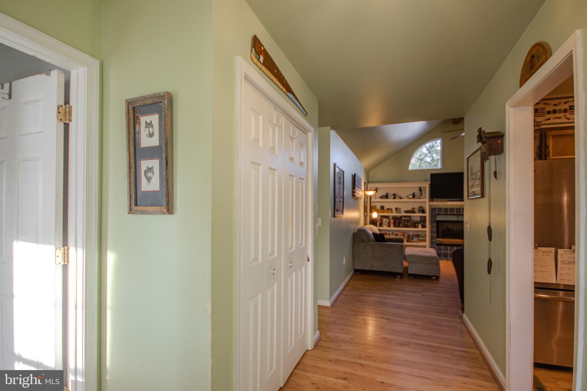 5520 Cedarcrest Road Salisbury, MD 21801 - Photo 8 of 41 a view of a hallway with living room and wooden floor