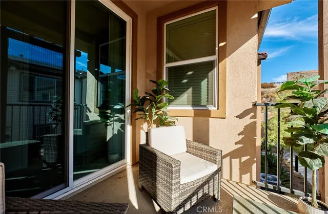 a view of balcony with wooden floor