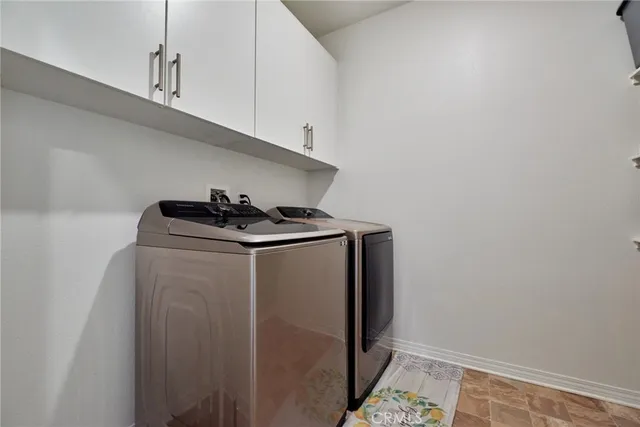 a bedroom with baby crib and a window