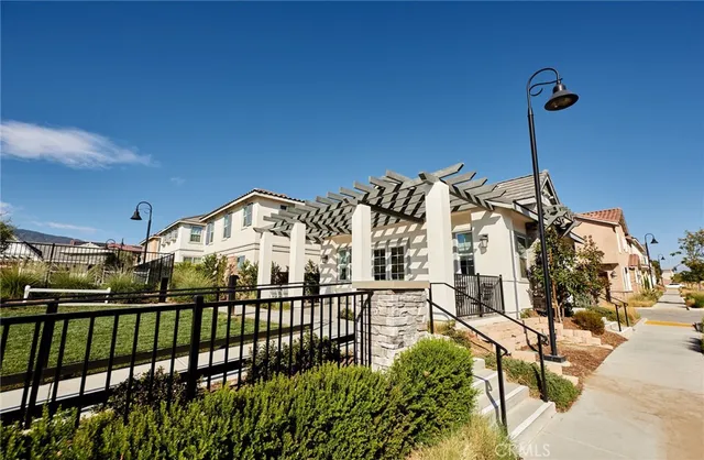 a front view of a house with a yard and a garage