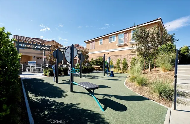 a view of a house with pool and sitting area