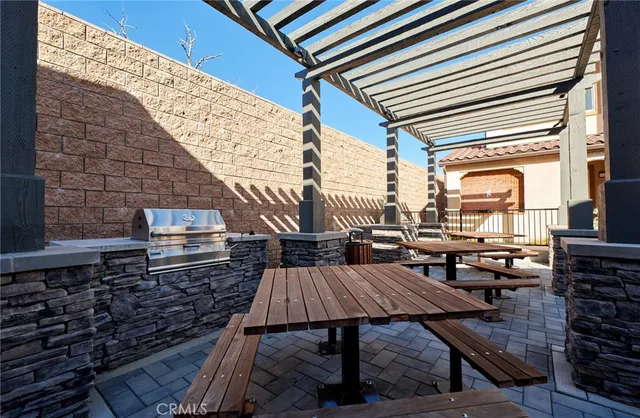 a view of a house with backyard porch and sitting area
