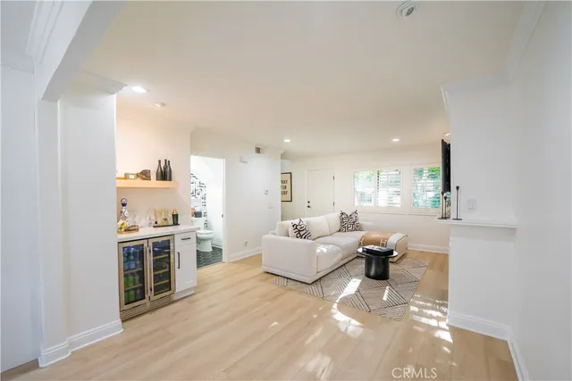 a view of kitchen and bathroom with wooden floor