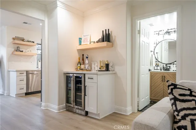 a kitchen with stainless steel appliances granite countertop a refrigerator sink and stove