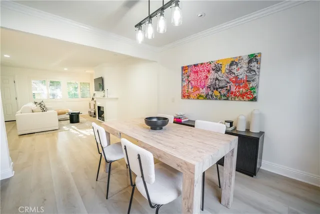 a living room with furniture and a view of bathroom