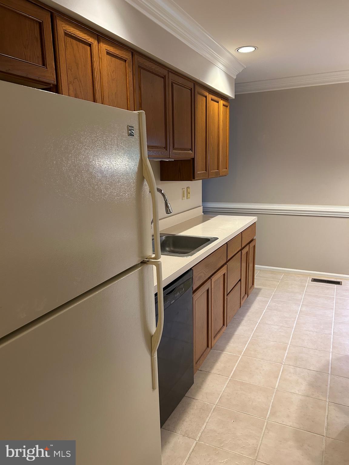 309 Newport Place Exton, PA 19341 - Photo 8 of 33 a kitchen with stainless steel appliances a refrigerator and a sink