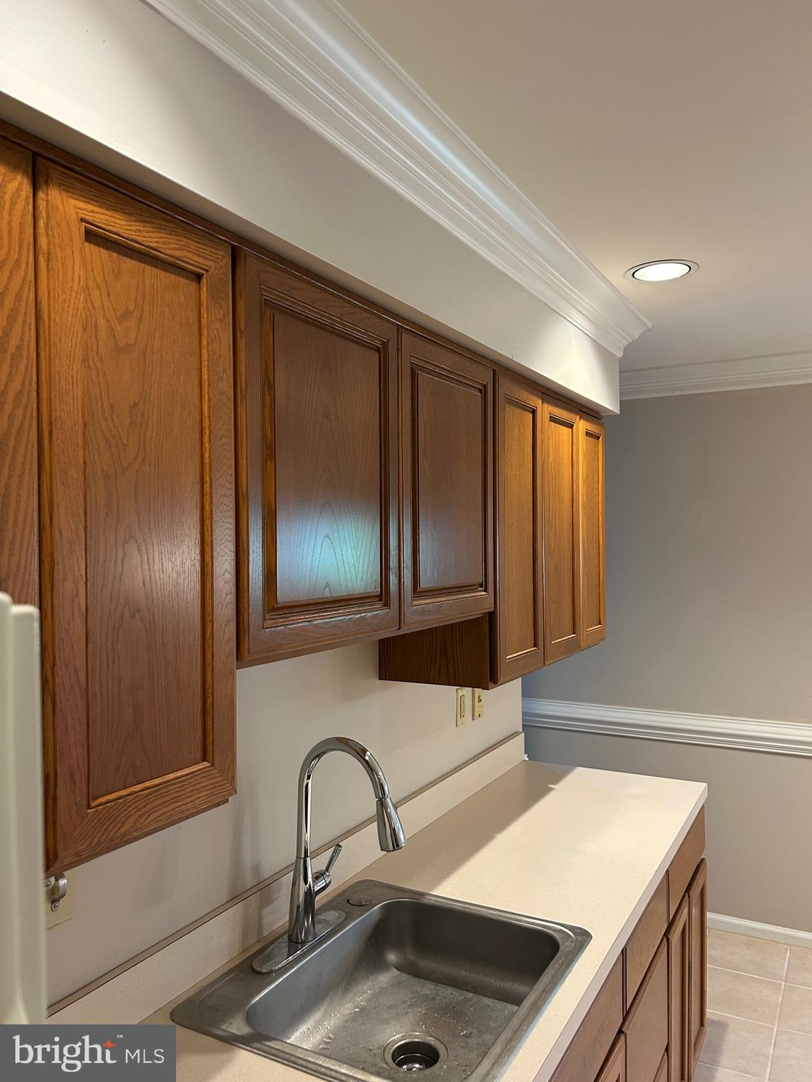 309 Newport Place Exton, PA 19341 - Photo 9 of 33 a kitchen with a sink and a refrigerator