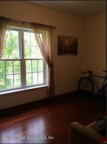 3871 Amboy Road, Unit 404 Staten Island, NY 10308 - Photo 11 of 17 a view of a livingroom with furniture and a window