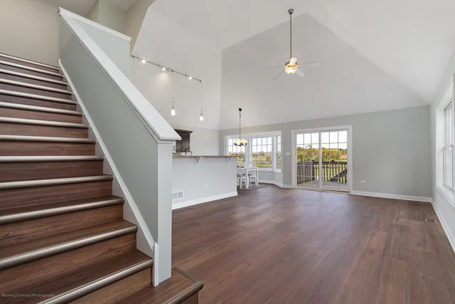 a view of an entryway with wooden floor