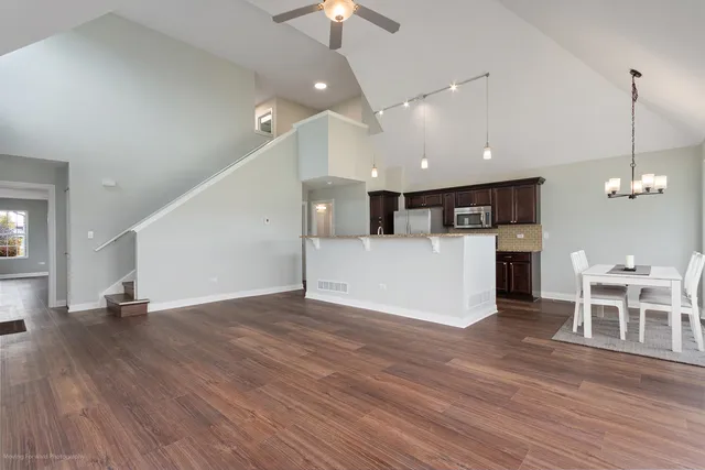 a view of a kitchen and dining room