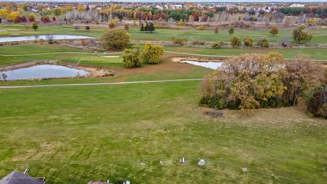a house that has a big yard with wooden fence