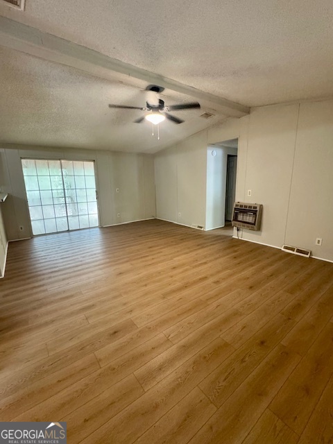 1769 Duncan Road Commerce, GA 30530 - Photo 2 of 16 an empty room with wooden floor and windows