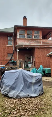 a view of a parking space with wooden fence