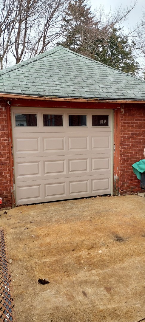 1231 South Float Avenue Freeport, IL 61032 - Photo 7 of 7 a view of a parking space with wooden fence