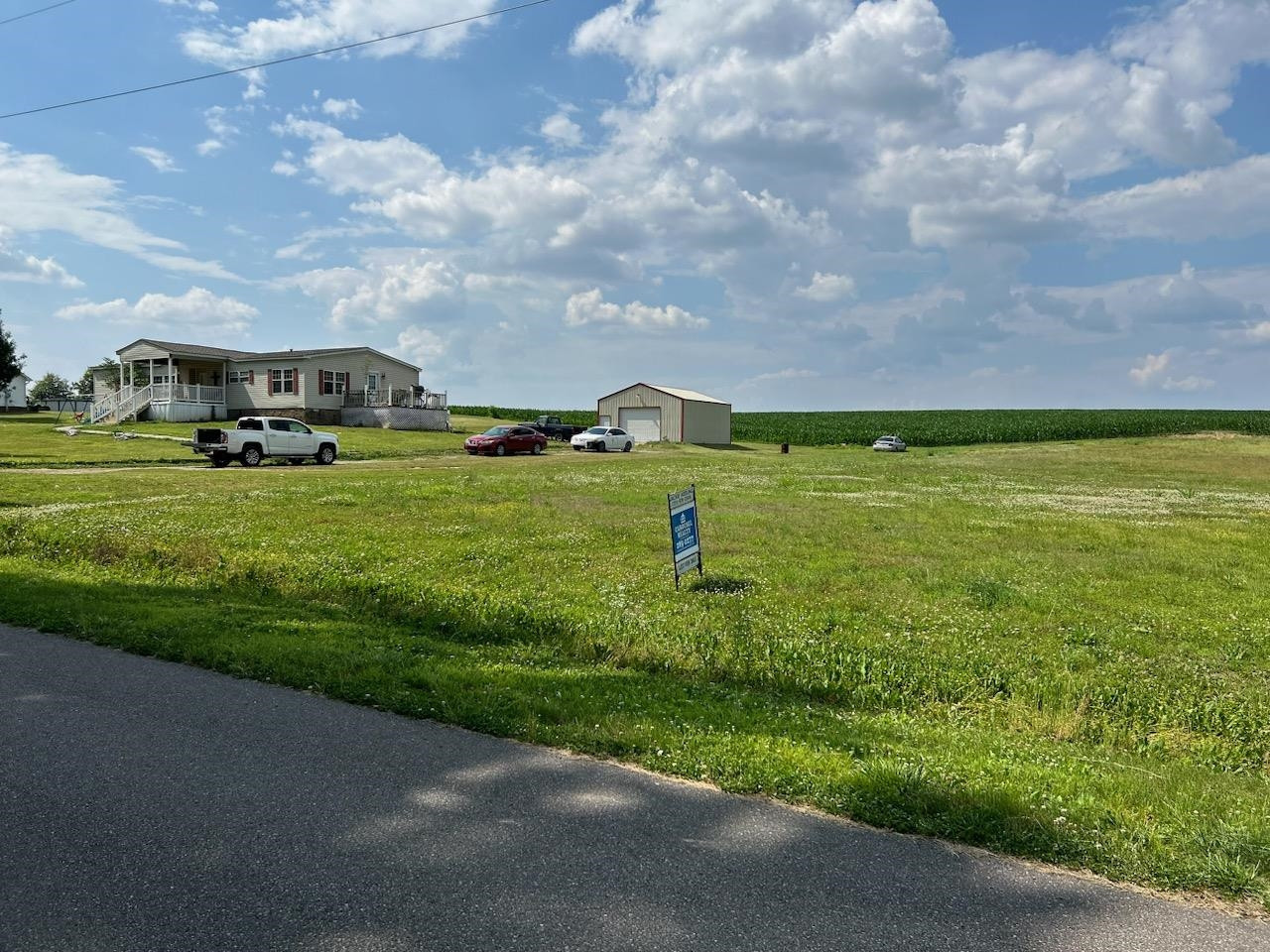 Lot 3 Maple Hill Road Newbern, TN 38059 - Photo 2 of 2 a view of a big yard with potted plants and sky view