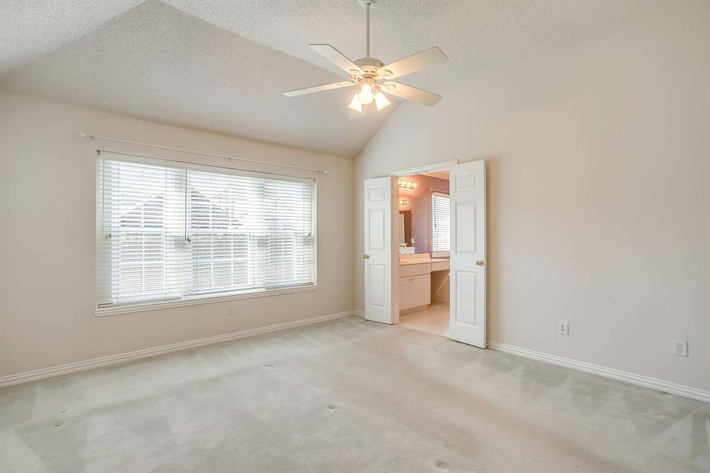 8105 Hosta Way Fort Worth, TX 76123 - Photo 21 of 33 an empty room with chandelier and windows