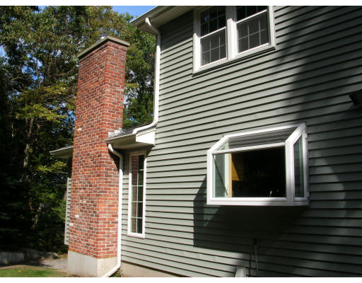 43 Williams Road Sharon, MA 02067 - Photo 4 of 15 a view of a brick house with a large windows
