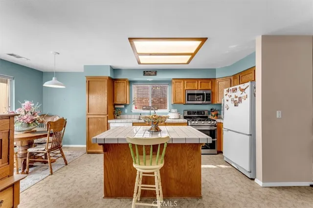 a dining table with chairs and window