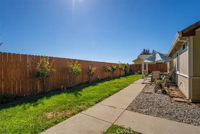 a view of a porch with furniture and garden