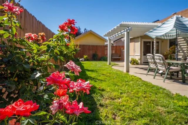 a front view of house with yard and outdoor seating
