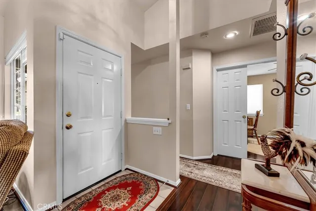 a view of room with furniture and wooden floor