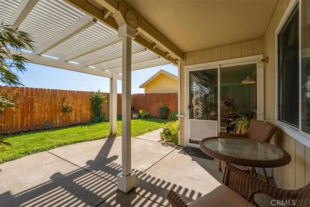 a house view with a sitting space and garden