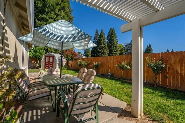 a view of an outdoor dining space with a patio