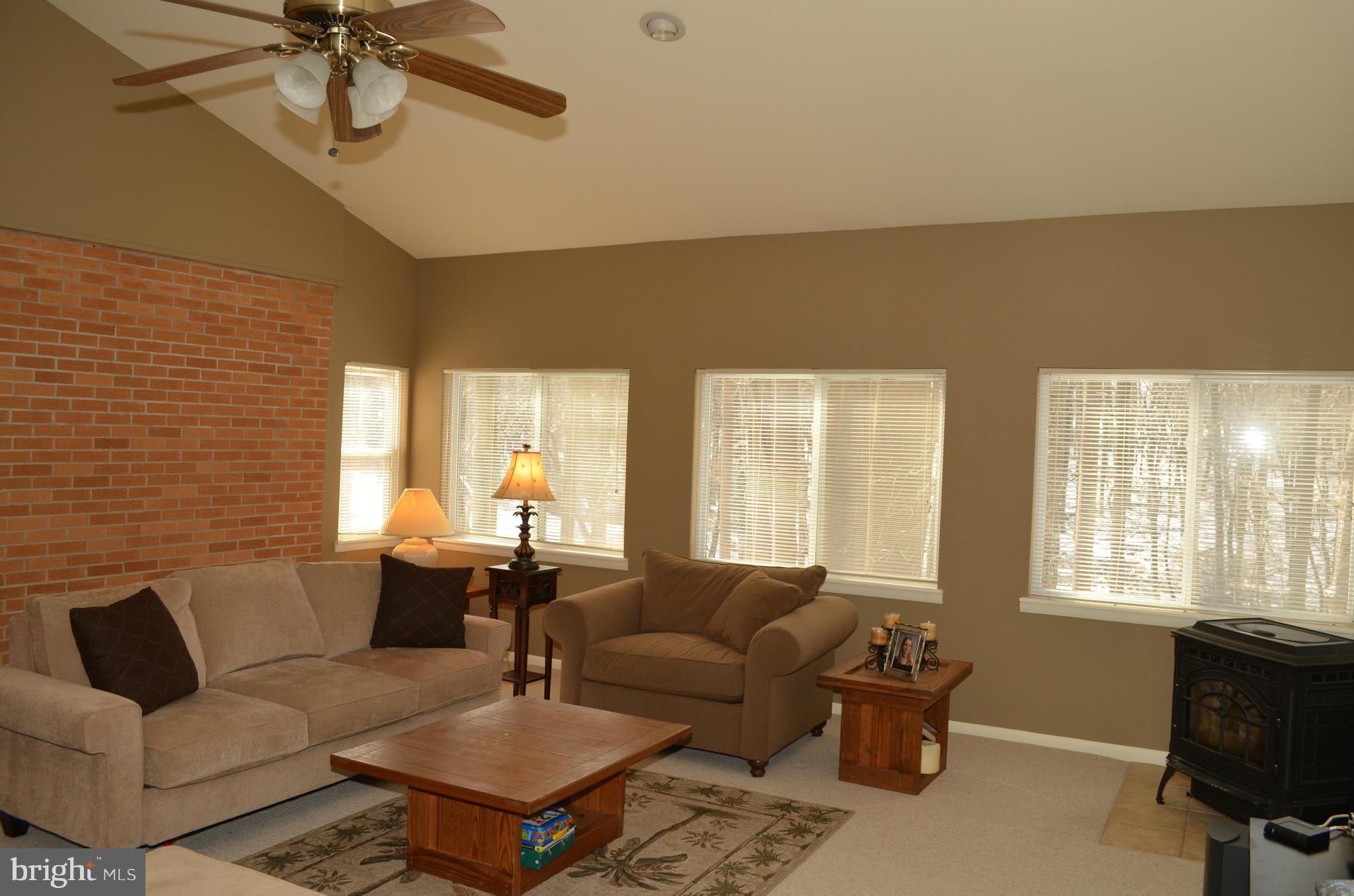 14314 Dairydale Road Baldwin, MD 21013 - Photo 14 of 27 a living room with furniture two window and a dining table