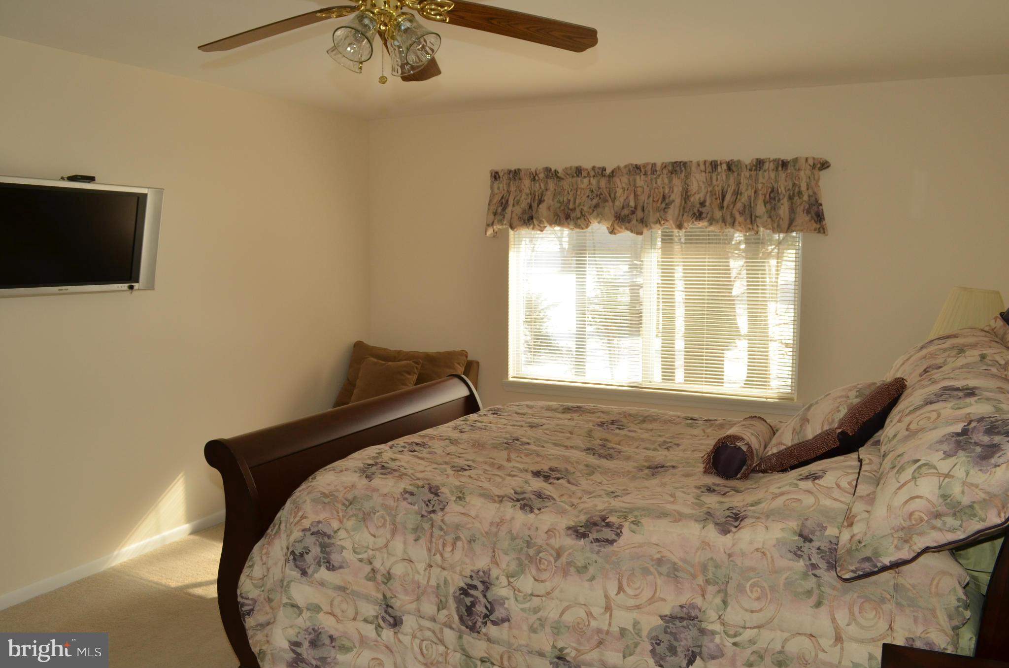 14314 Dairydale Road Baldwin, MD 21013 - Photo 17 of 27 a bed sitting in a bedroom next to a window