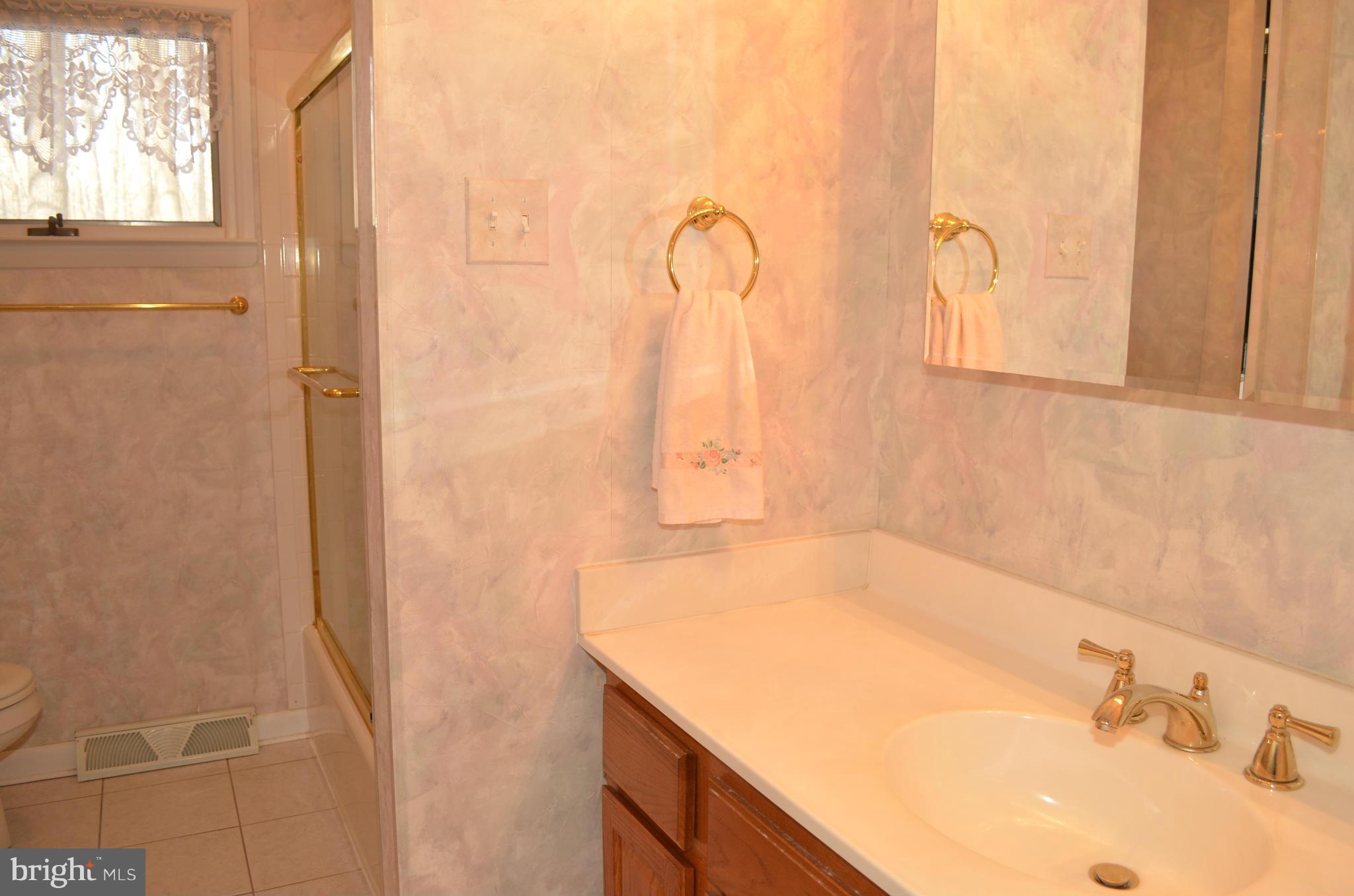 14314 Dairydale Road Baldwin, MD 21013 - Photo 21 of 27 a bathroom with a sink and a mirror