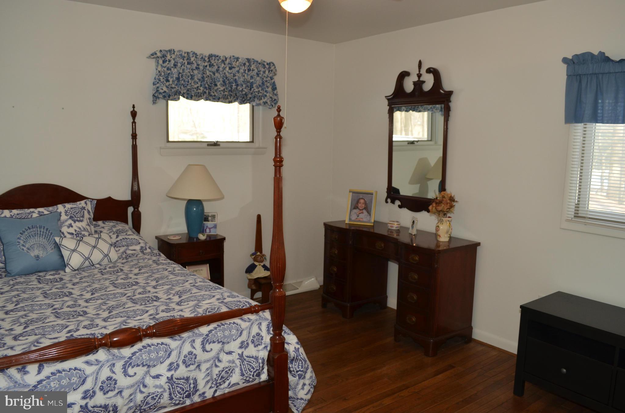 14314 Dairydale Road Baldwin, MD 21013 - Photo 23 of 27 a bedroom with a bed and wooden floor