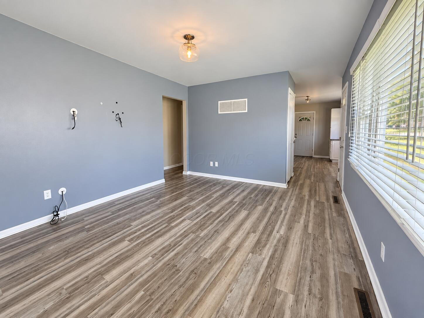 1769 Ward Road Columbus, OH 43224 - Photo 5 of 18 Living Room -Bright living space featuring low-maintenance, durable vinyl plank flooring.