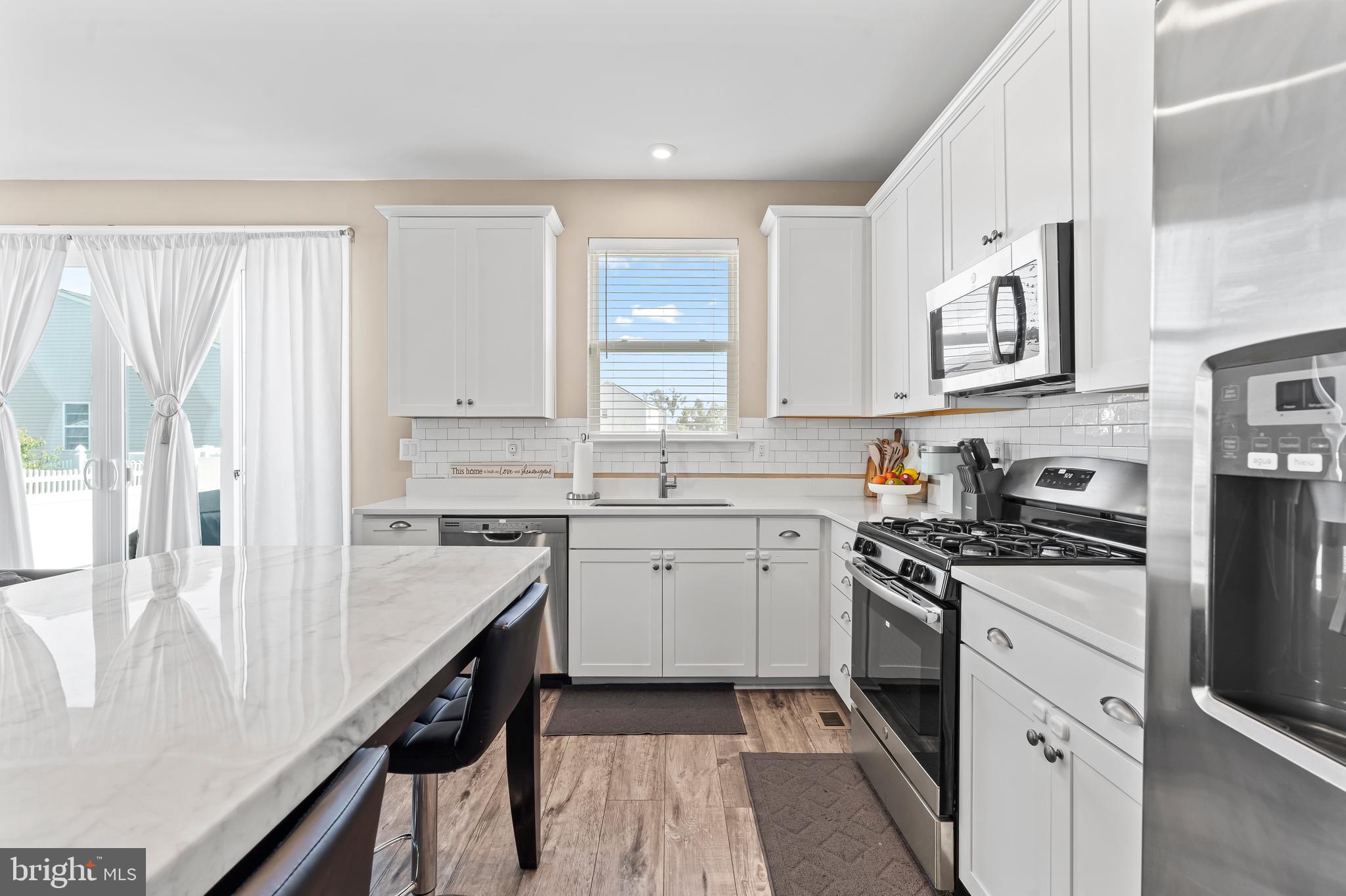 17330 Kilpatrick Court Hagerstown, MD 21740 - Photo 16 of 31 a kitchen with granite countertop white cabinets and white appliances