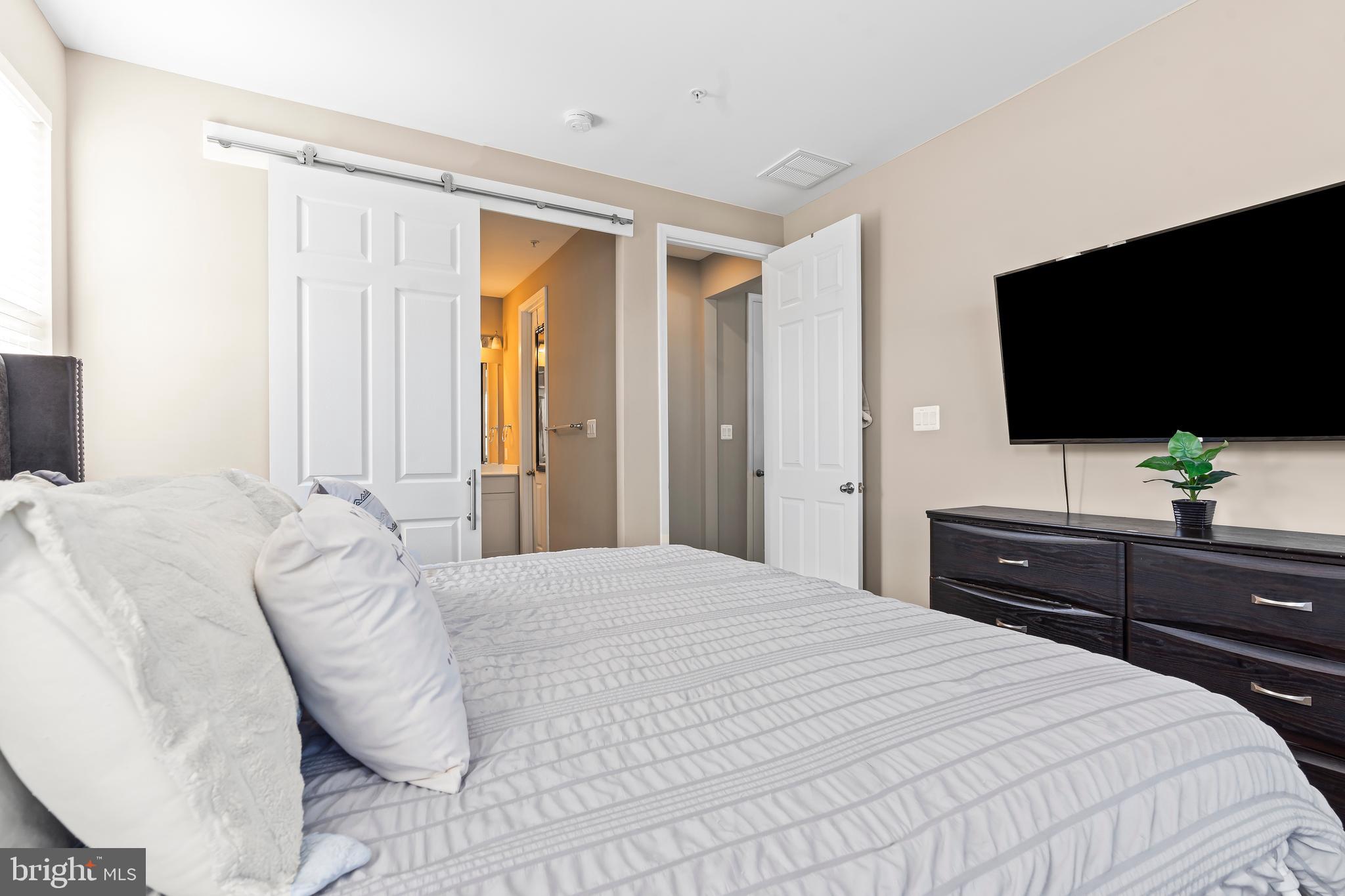 17330 Kilpatrick Court Hagerstown, MD 21740 - Photo 21 of 31 a bedroom with a bed and a flat screen tv