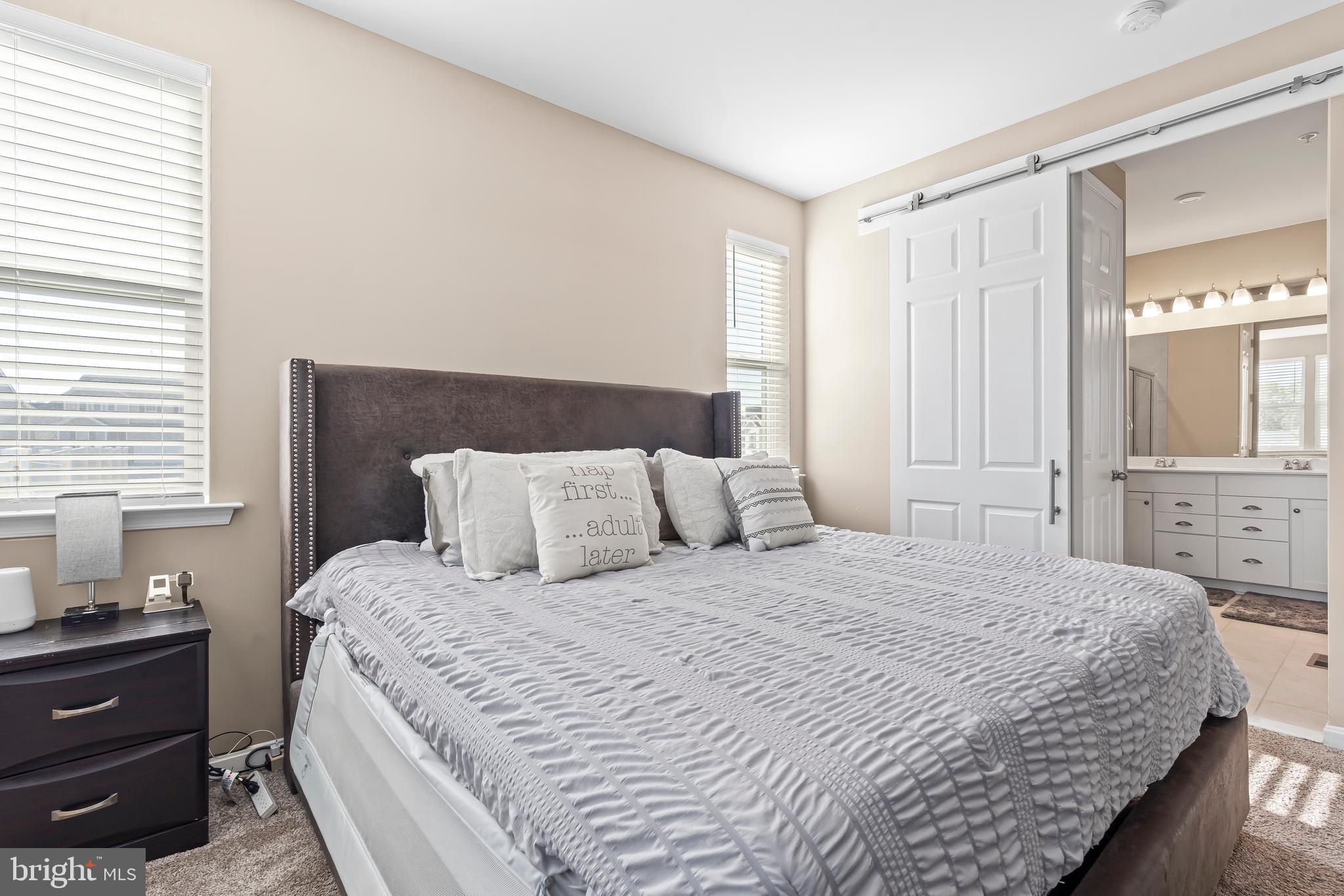 17330 Kilpatrick Court Hagerstown, MD 21740 - Photo 22 of 31 a bedroom with a bed and a chandelier