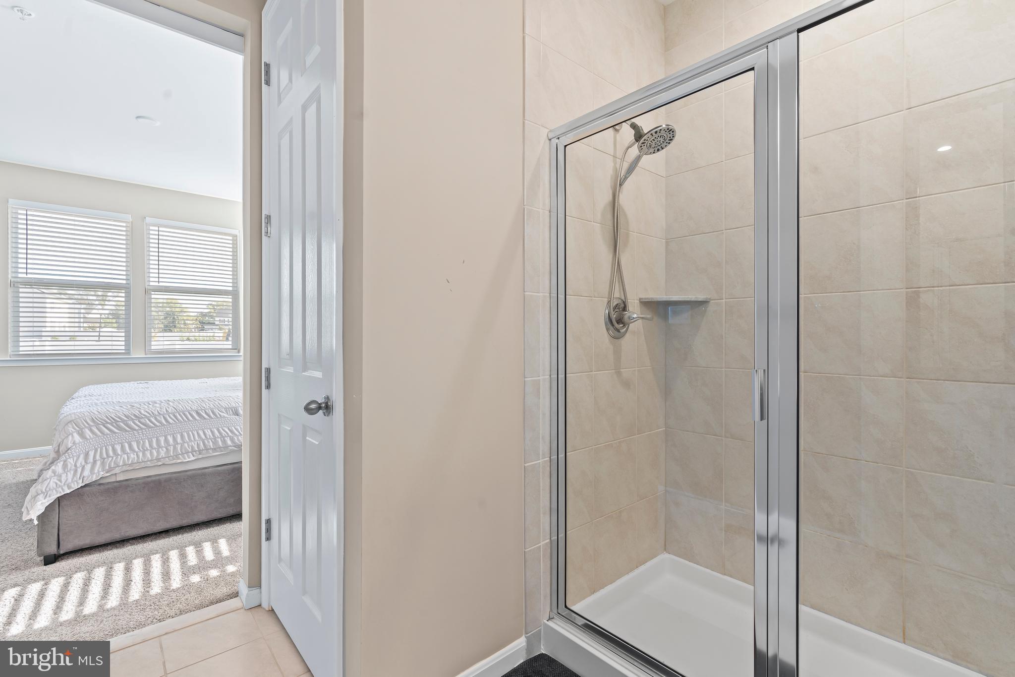 17330 Kilpatrick Court Hagerstown, MD 21740 - Photo 23 of 31 a bathroom with a shower and a glass door