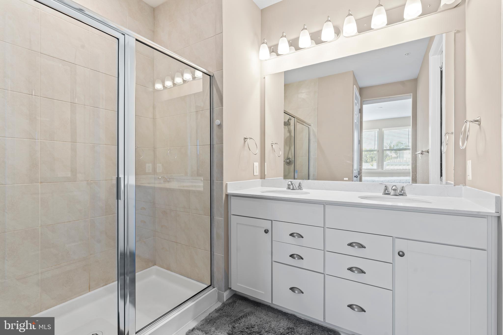 17330 Kilpatrick Court Hagerstown, MD 21740 - Photo 24 of 31 a bathroom with double sink and a mirror