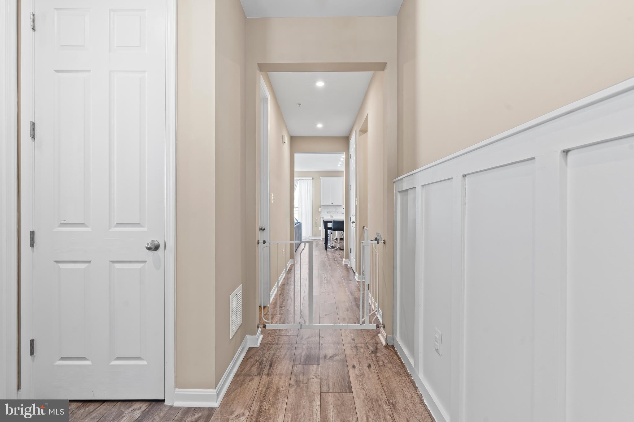 17330 Kilpatrick Court Hagerstown, MD 21740 - Photo 8 of 31 a view of a hallway with wooden floor and a hallway
