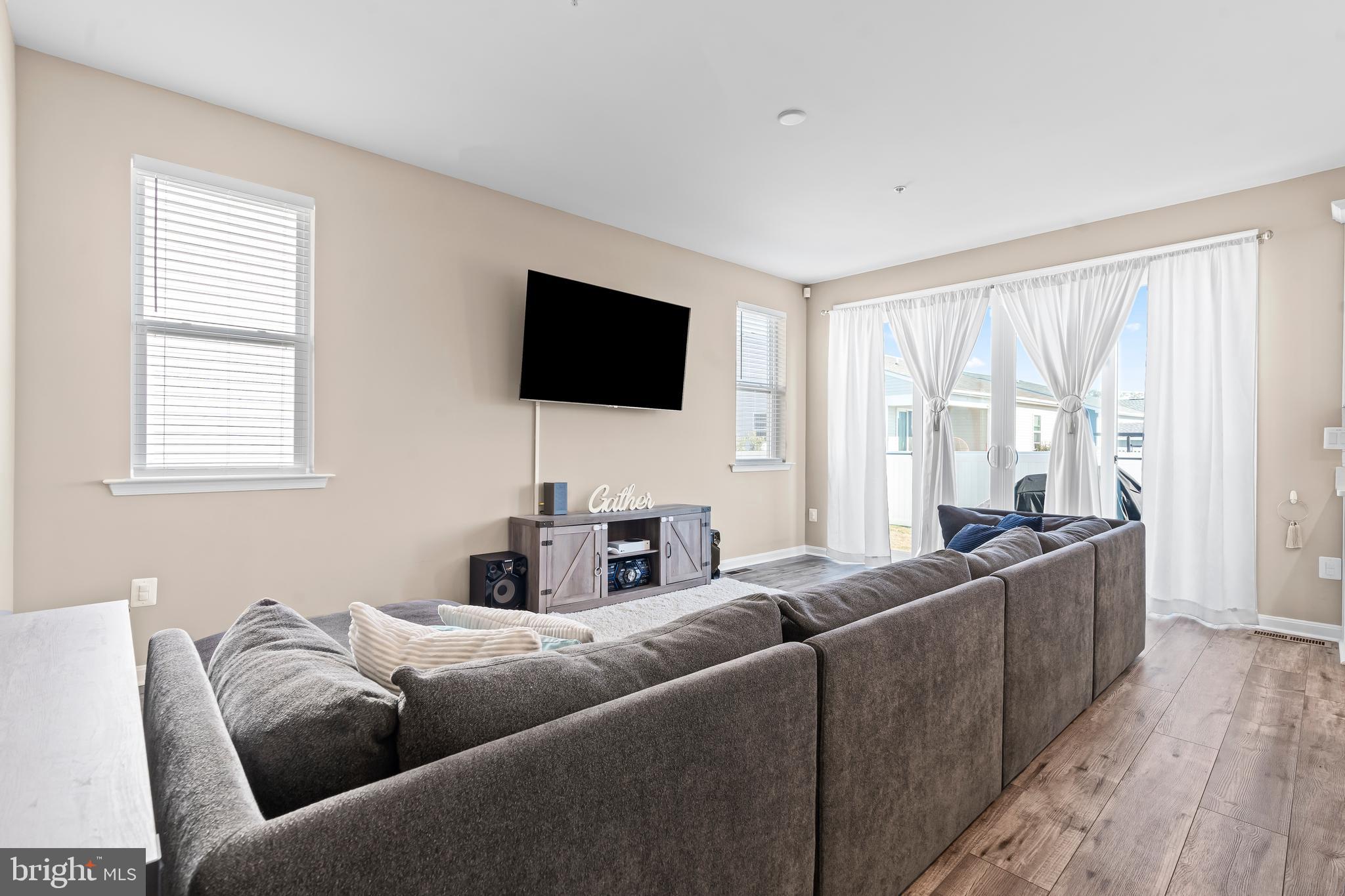17330 Kilpatrick Court Hagerstown, MD 21740 - Photo 10 of 31 a living room with furniture a flat screen tv and a window