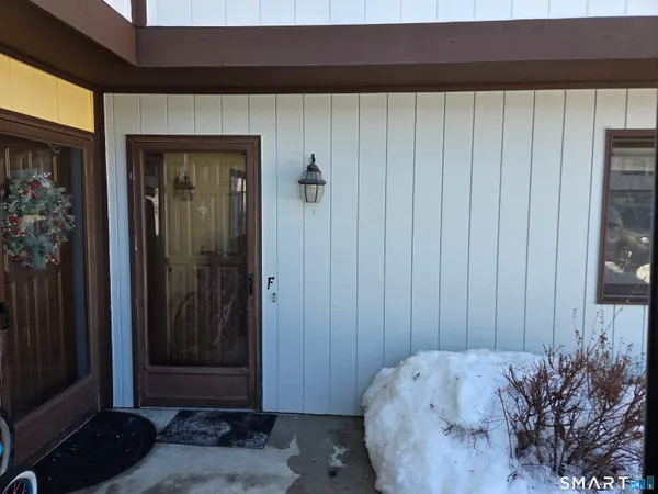 a bed room with a bed and a mirror