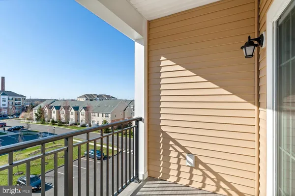 a view of a balcony with furniture