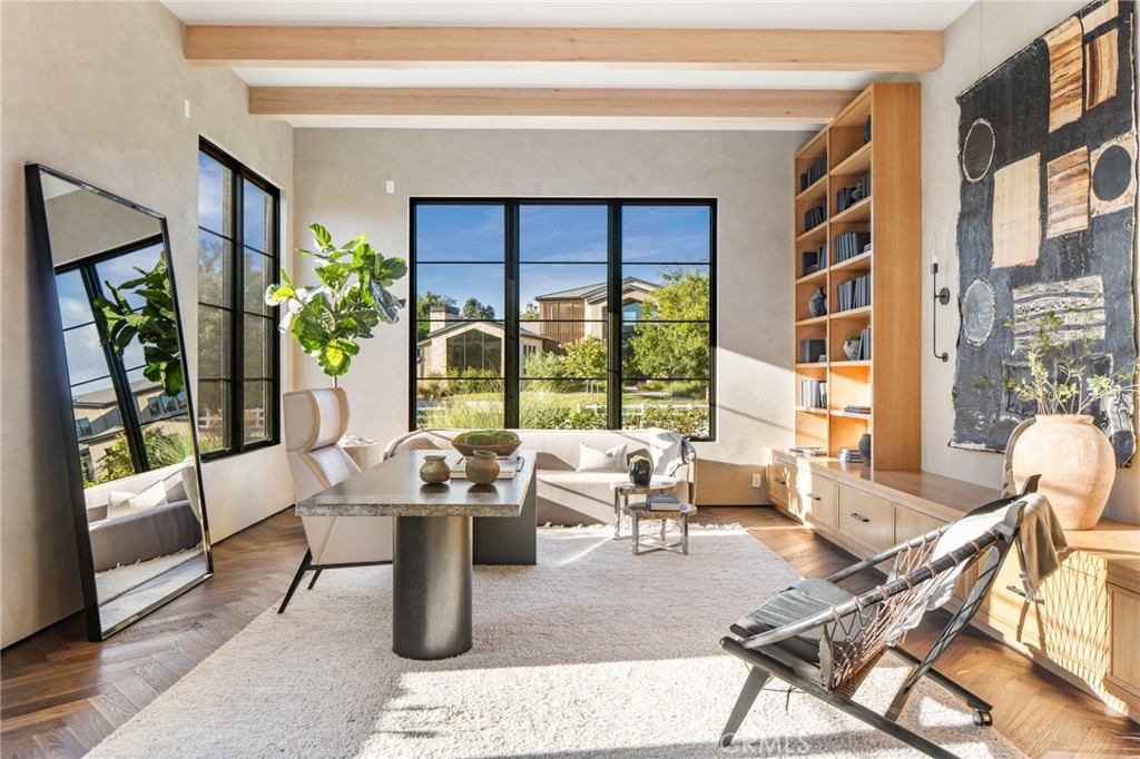24050 Hidden Ridge Road Hidden Hills, CA 91302 - Photo 16 of 45 a living room with patio furniture and a potted plant