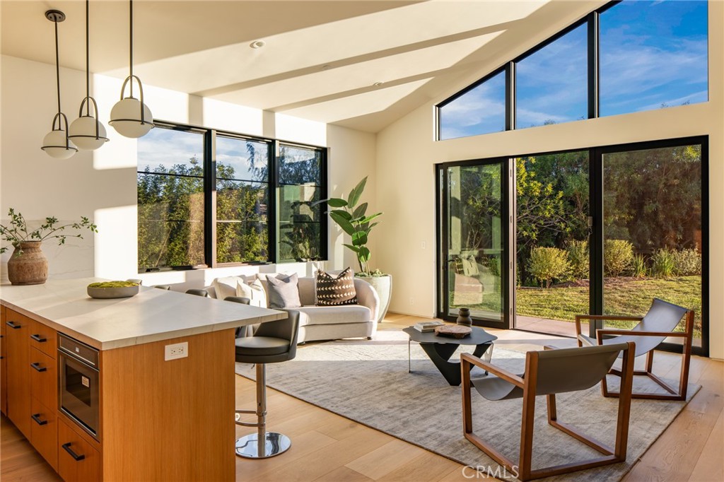 24050 Hidden Ridge Road Hidden Hills, CA 91302 - Photo 32 of 45 a view of a living room with furniture and floor to ceiling windows
