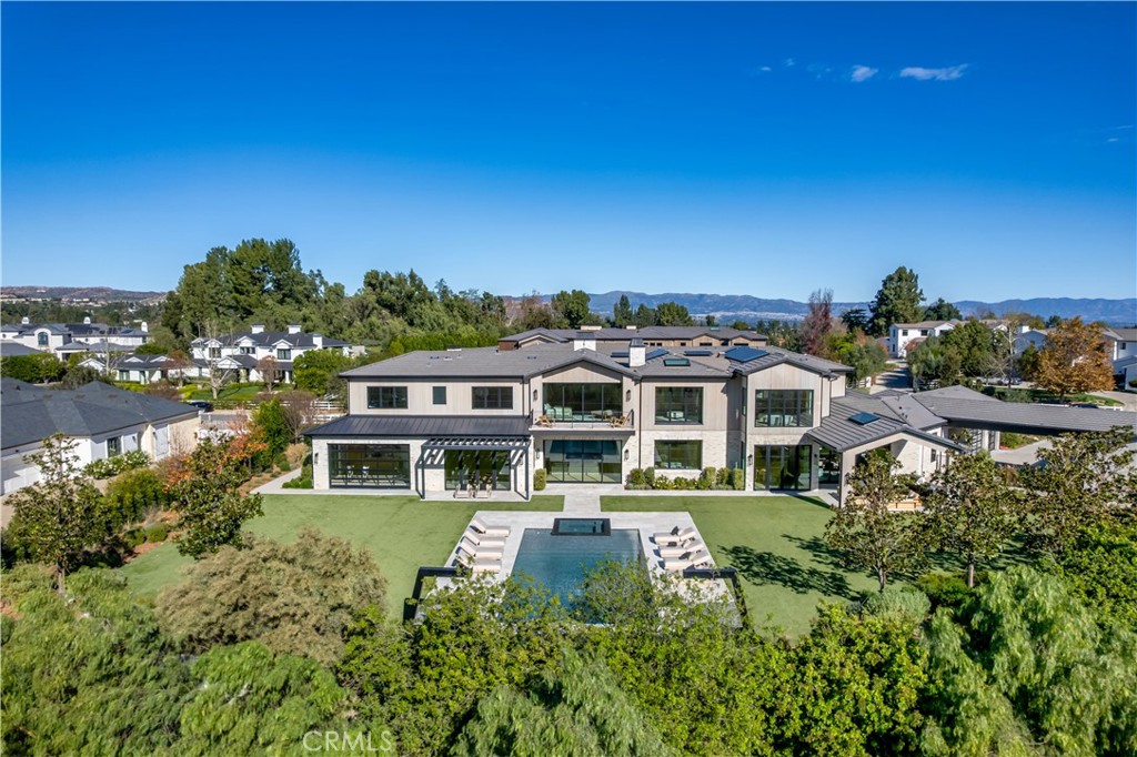24050 Hidden Ridge Road Hidden Hills, CA 91302 - Photo 43 of 45 aerial view of a house with a yard