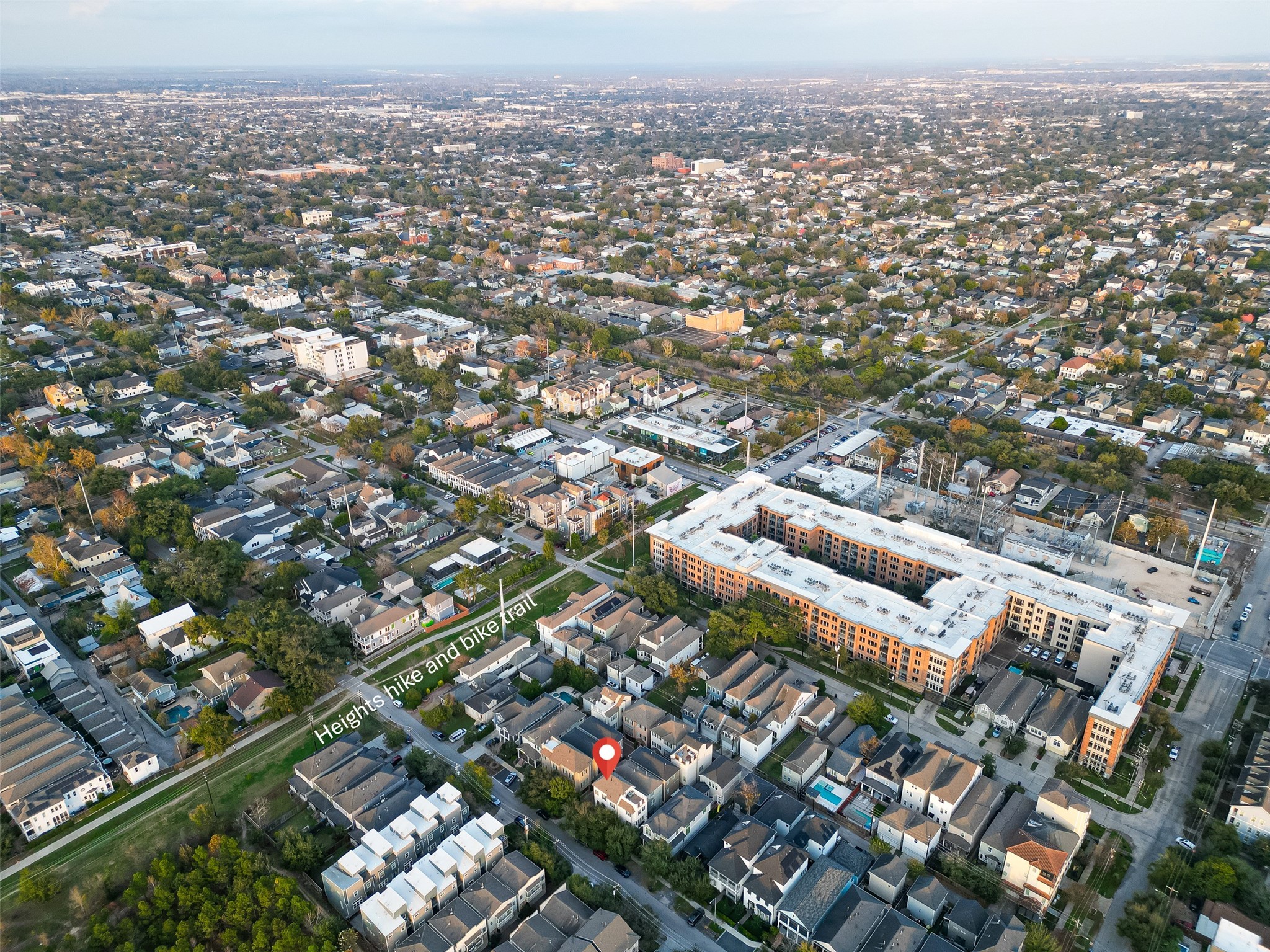 620 Rutland Street, Unit A Houston, TX 77007 - Photo 42 of 46 This aerial photo showcases a vibrant neighborhood with a mix of residential and commercial buildings. The area features a well-maintained bike and hike trail, offering easy access to outdoor activities.