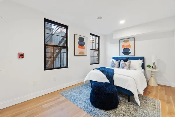 a bedroom with a bed and a dresser