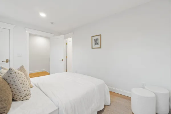 a view of hallway with wooden floor